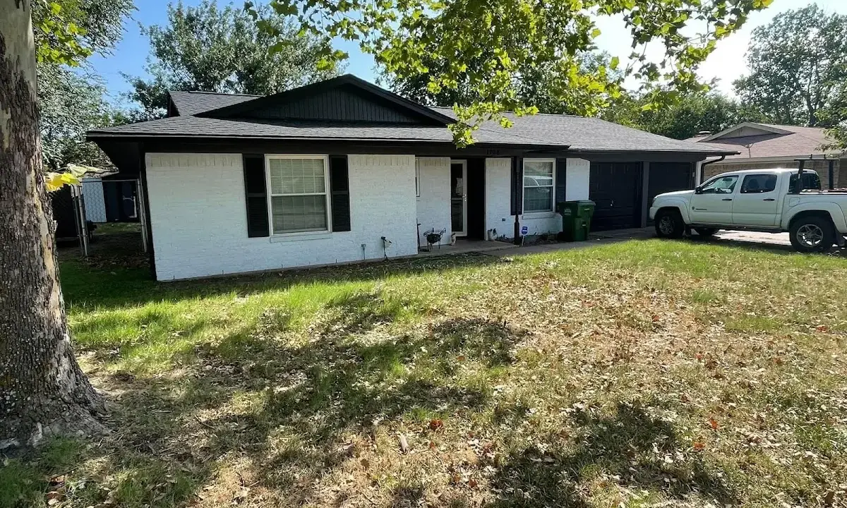 Professional roofing crew working on a residential roof in Jeffersonville